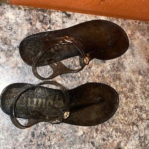 these are juicy couture sandals they are black and gold SIZE 8.